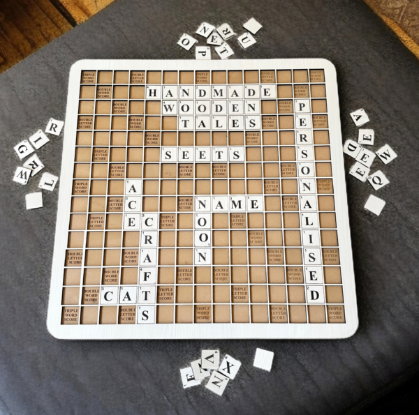 Handmade 18-inch wooden Scrabble board game with 128 MDF wood tiles on a rustic table, perfect for family game nights or home decor.